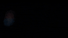 a pixelated image of a person looking out a window at the ocean