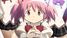 a girl with pink hair has sora and kia < 3 written on her sleeve