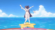a girl in a bikini is standing on a star in the water
