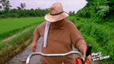 a man in a straw hat is driving a tractor with the words hantu kalimah balik rumah written on the side