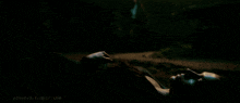 a woman is laying on the ground in a dark room and the website p3nstv3.tumblr.com is visible in the corner