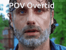 a man with a beard has the words pov overtid written on his face