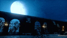 an illustration of a building with a full moon in the background and the words illusive soul at the bottom