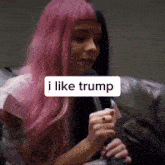 a woman with pink hair is holding a microphone and says " i like trump "