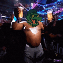 a man in ufc shorts is holding a beer in his hand