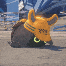 a cartoon character wearing a hard hat with chinese writing on it