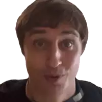 a close up of a man making a surprised face