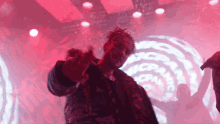 a man giving the middle finger in front of a logo that says ncpawc