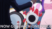 a man in a suit is holding a pink and red balloon with the words `` now go watch one piece '' .