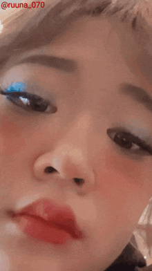 a close up of a woman 's face with the hashtag @ruuna_070 on the bottom