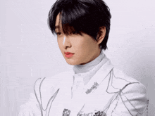 a man in a white suit has red lipstick on