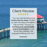 a client review with a picture of a pier in the ocean