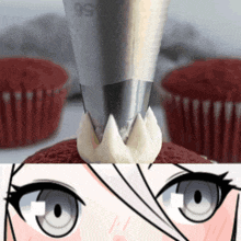 a close up of a cupcake with frosting and a drawing of a woman 's eyes