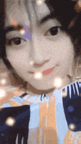 a close up of a girl 's face with a striped shirt