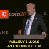 a man in a suit and tie stands at a podium with the words i will buy billions and billions of xcm