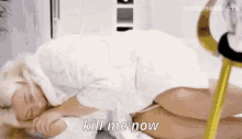 a woman in a white robe is laying on the floor with the words kill me now written on the bottom