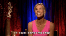 a woman in a pink tank top is saying if i could i 'd give a hug a hug