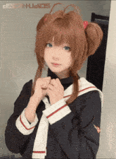 a girl in a sailor suit stands in front of a sign that says jets studios