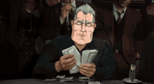a man in a suit is holding a bunch of money in his hands
