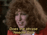a woman with red hair says " does the phrase needle-dick " in yellow letters
