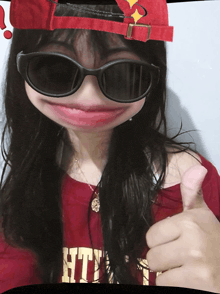 a girl wearing sunglasses and a red hat with the word htc on it