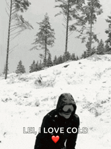 a black and white photo of a person in the snow with the words lei i love cold above them