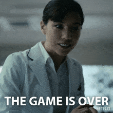 a woman in a lab coat with the words the game is over netflix below her