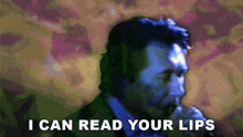 a man singing into a microphone with the words " i can read your lips " above him
