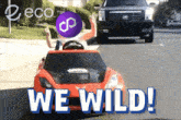 a red toy car with the words we wild on the bottom