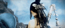 a woman is holding a sword with a butterfly on her head .
