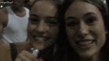 a gif of two women smiling with margaritogif written on the bottom
