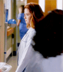 Greys Anatomy April Kepner GIF - Greys Anatomy April Kepner Peeking GIFs