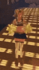 a cheerleader is holding a bunch of yellow pom poms in her hand