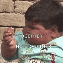 a very fat child is eating a cookie with the words together not together written on the bottom .