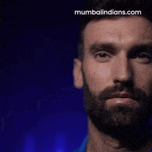 a man with a beard and the website mumbaiindians.com