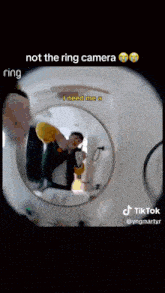 a man is taking a picture of himself with a ring camera