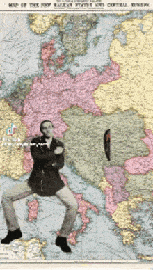 a man is standing on a map of europe
