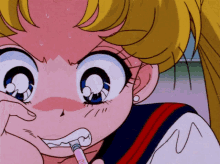 a girl brushing her teeth with a pink toothbrush