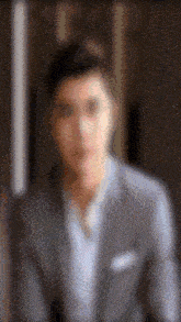 a blurry picture of a man in a suit