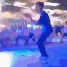 a blurry picture of a person in a blue outfit