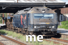 a train that says contec rail 1530 on the front
