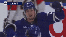 a hockey player with the word leafs on the bottom