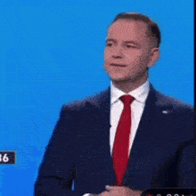 a man stands at a podium with a sign that says 25 on it