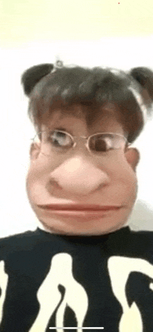 a person wearing a monkey mask and glasses .