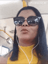 a woman wearing sunglasses and ear buds on a bus with pixverse.ai written in the corner