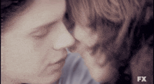 a close up of a couple kissing with fx written on the bottom