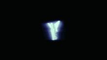 a glowing angel in the dark with wings