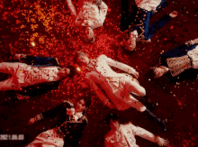 a group of men are laying on their backs with confetti falling around them and the date 2021.06.06
