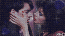 a picture of a man and woman kissing with blue roses in the background and picmix at the bottom