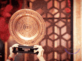 a person holding a trophy that says winner 2020 on it